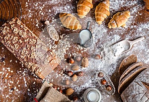 At the bakery, still life with mini Croissants, bread, milk, nuts and flour