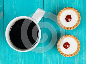 Bakewell Tarts With a Mug of Black Coffee