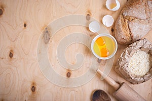 Baking background with bread, eggshell, flour, rolling pin
