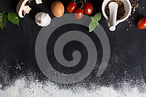 Baking background with copy space on black surface for your text. Top view. Food ingredients on the table vegetables and