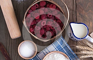 Baking background with copy space. Cooking ingredients for yeast dough and pastry, eggs, flour and milk on white rustic wood. Mock