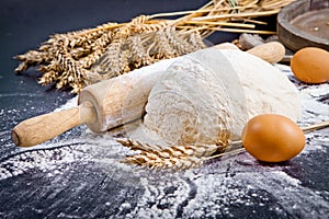 Baking background with eggshell, flour and rolling pin. Pizza co