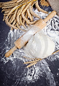Baking background with eggshell, flour and rolling pin. Pizza co