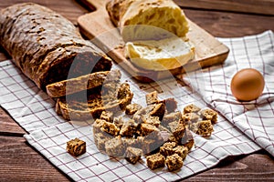 Baking bread ingredients on wooden table background