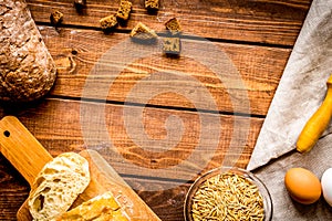 Baking bread ingredients on wooden table background top view mockup