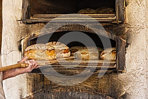 Baking bread in an old time stone woodfired oven