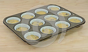 Baking breakfast muffins in muffin pan photo