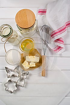 Baking cake . Dough recipe ingredients eggs, flour, milk, butter, sugar and rolling pin