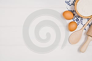Baking cake or pizza ingredients top view on wooden background