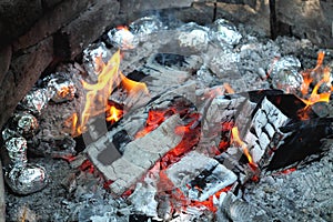 Baking at the camp fire photo