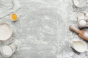 Baking concept flat lay. Ingredients, kitchen utensils, grey concrete background