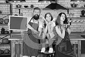 Baking cookies. Culinary school. Mother father and daughter cooking together. Child with parents cooking in kitchen