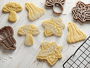 Baking cookies in the form of pumpkin and leaves