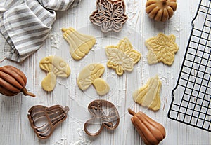 Baking cookies in the form of pumpkin and leaves