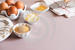 Baking or cooking background frame. Ingredients, kitchen items for baking cakes. Kitchen utensils, flour, eggs, brown sugar,
