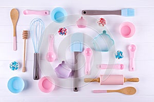 Baking and cooking concept. Pattern made of cookie cutters, whisk, roller pin and kitchen bake tools for making sweets.