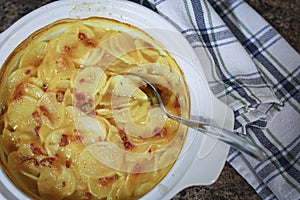 Baking dish full of freshly baked potato casserole