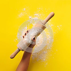 Baking flat lay with rolling pin, flour on yellow paper background. Bake menu, recipe, homemade pastry concept. Top view. Banner