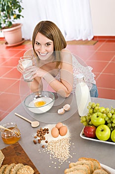 Baking - Happy woman prepare healthy ingredients photo