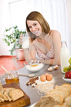 Baking - Happy woman prepare healthy ingredients photo