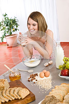 Baking - Happy woman prepare healthy ingredients photo