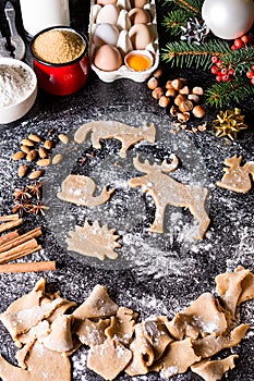 Baking ingredients for Christmas cookies gingerbread. Molds for baking, spices and decorations for Christmas.