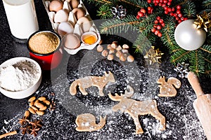 Baking ingredients for Christmas cookies gingerbread. Molds for baking, spices and decorations for Christmas.