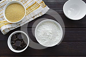 Baking ingredients for dessert on brown wooden table