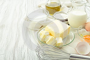 Baking ingredients eggs, flour, sugar, butter, vanilla, cream photo