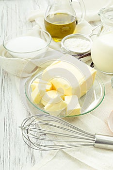 Baking ingredients eggs, flour, sugar, butter, vanilla, cream photo