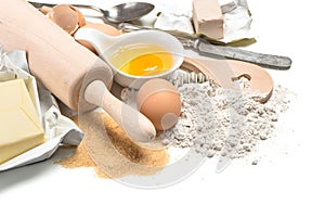 Baking ingredients eggs, flour, sugar, butter, yeast