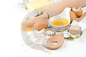 Baking ingredients eggs, flour, yeast, sugar, butter
