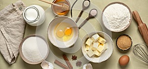 Baking background banner. Baking ingredients: flour, eggs, sugar, butter, milk and spices. Top view