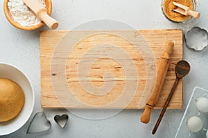 Baking ingredients and kitchen utensils on a white background top view. Preparing heart sugar cookies. Baking background. Flour,