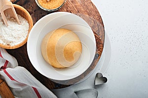 Baking ingredients and kitchen utensils on a white background top view. Preparing heart sugar cookies. Baking background. Flour,