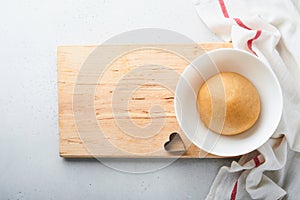 Baking ingredients and kitchen utensils on a white background top view. Preparing heart sugar cookies. Baking background. Flour,