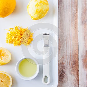 Baking ingredients for a lemon cake - whole lemon and lemon rind photo