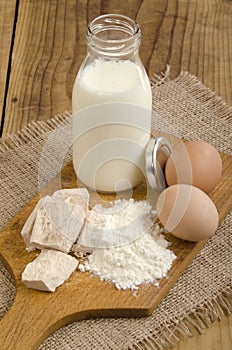 Baking ingredients, milk, flour, eggs and yeast