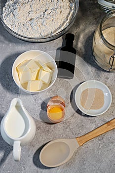 baking ingredients ob grey marble table, top view