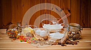 Baking ingredients and spices on wooden background.