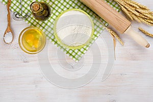 Baking ingredients and utensils background with bottom side copyspace