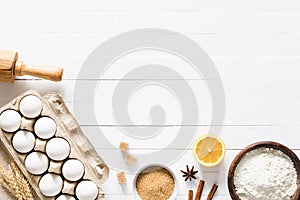 Baking ingredients on white wooden table background