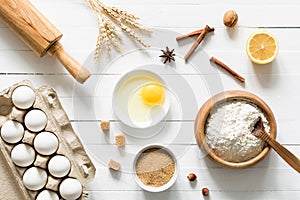 Baking ingredients on white wooden table background