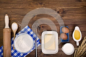 Baking ingredients on wooden background