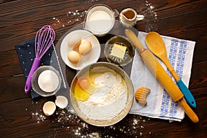 Baking ingredients on wooden table top