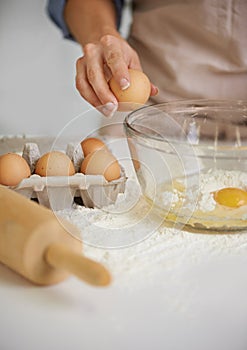 Baking, kitchen and person with eggs and flour for cake, bread and pastry preparation in home. Culinary, bakery and