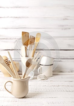 Baking kitchenware and baking products on white wooden background