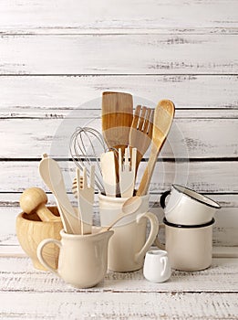 Baking kitchenware and baking products on white wooden background