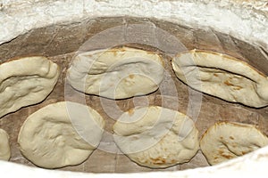 Baking pita bread in a stone oven