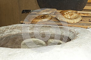 Baking pita bread in a stone oven